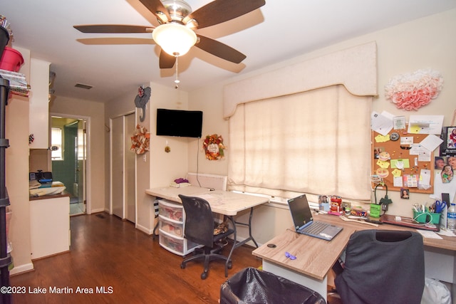 home office featuring ceiling fan and dark hardwood / wood-style flooring