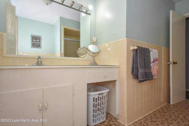 bathroom with tile walls