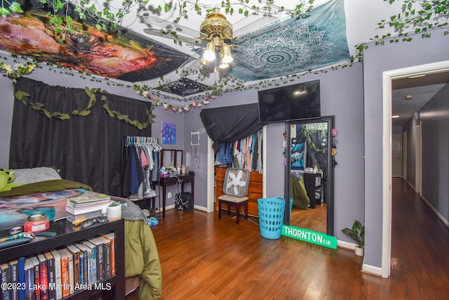 bedroom with hardwood / wood-style floors