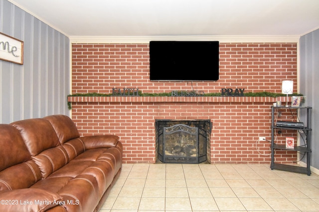 tiled living room with crown molding, brick wall, and a brick fireplace