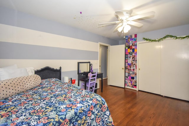 bedroom with a closet, ceiling fan, and dark wood-type flooring