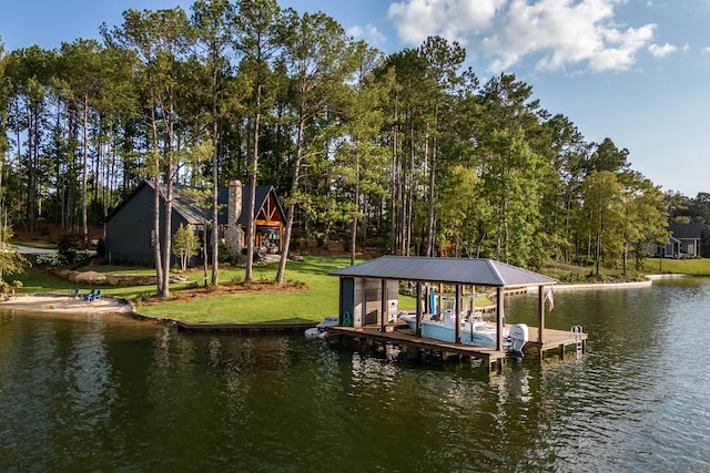view of dock featuring a yard, boat lift, and a water view