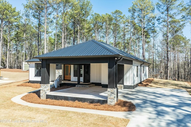 back of property with metal roof