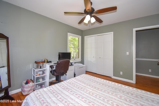 bedroom featuring light wood-type flooring, a closet, and baseboards