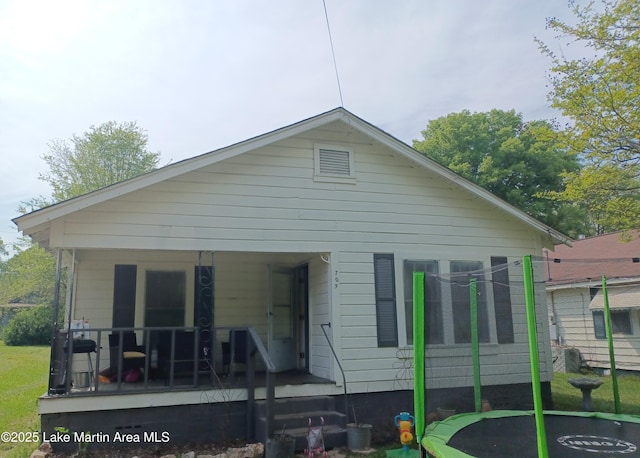 back of property with covered porch