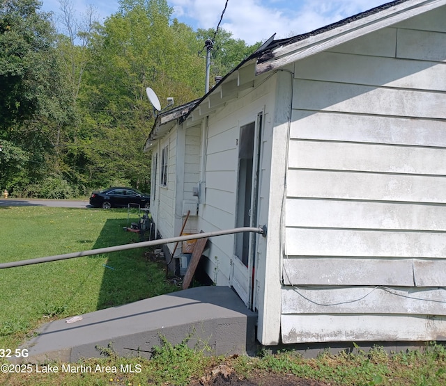 view of property exterior with a yard