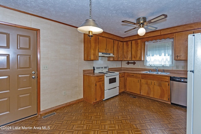 kitchen featuring sink, light parquet floors, decorative light fixtures, white appliances, and ornamental molding