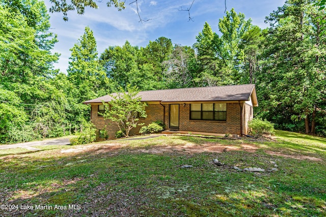 ranch-style house with a front lawn