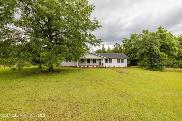 view of front of house with a porch and a front lawn