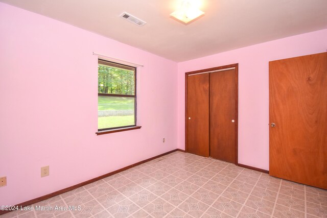 unfurnished bedroom featuring a closet