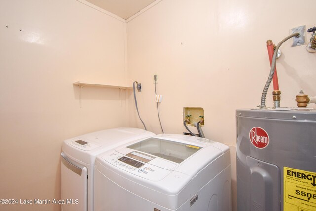 washroom with electric water heater and washer and clothes dryer