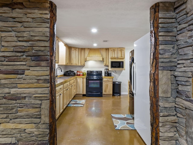 kitchen with custom exhaust hood, light brown cabinets, black appliances, sink, and a textured ceiling