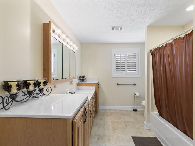 full bathroom with a textured ceiling, vanity, toilet, and shower / bath combination with curtain