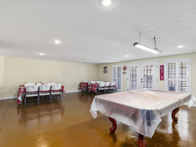 game room featuring french doors, a textured ceiling, and billiards