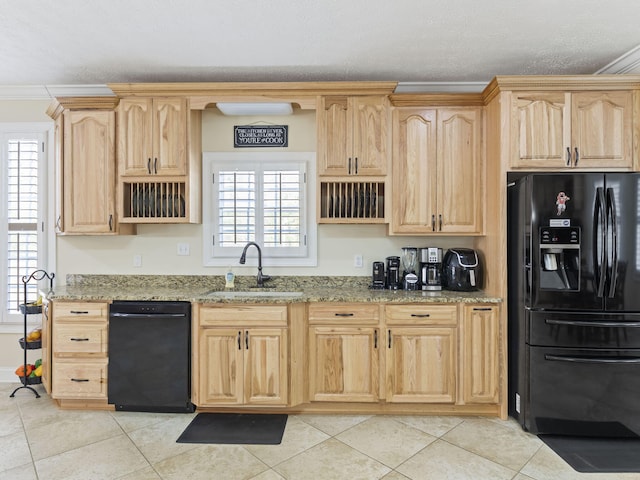 kitchen featuring a healthy amount of sunlight, sink, black appliances, and ornamental molding