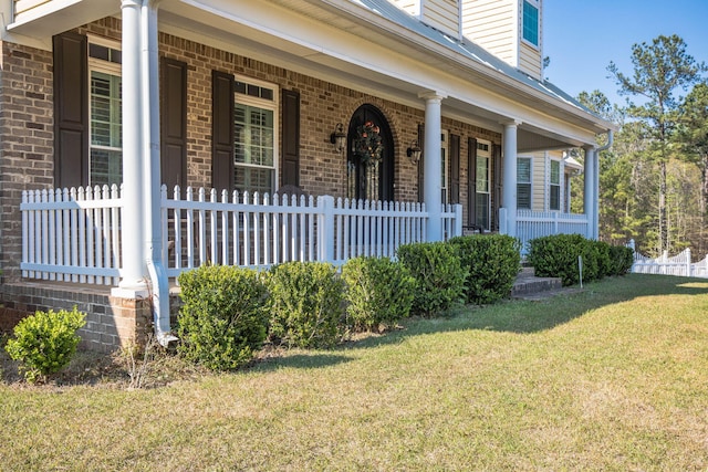 property entrance with a yard