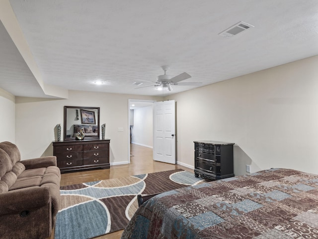 bedroom with ceiling fan and light hardwood / wood-style floors