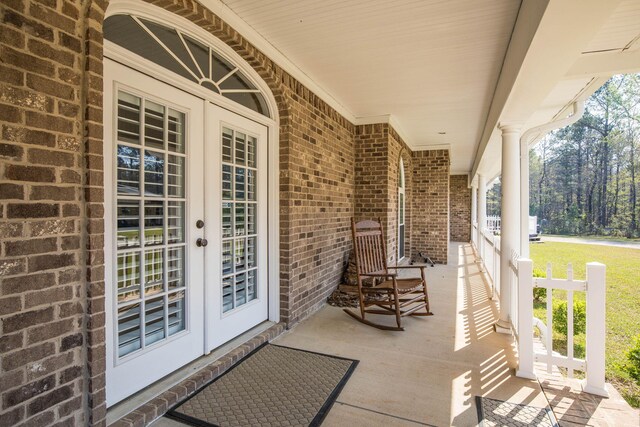 view of patio / terrace featuring french doors and covered porch