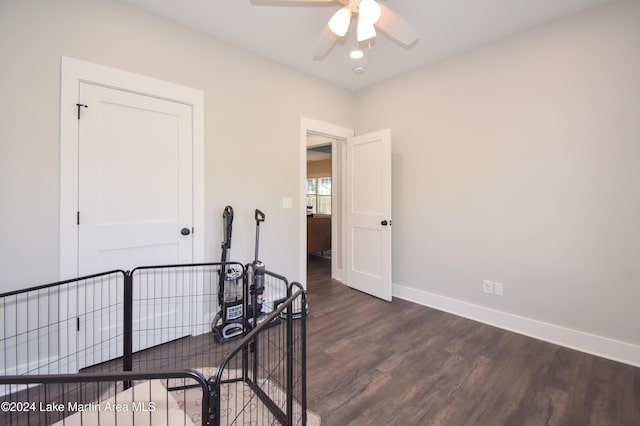 hall with dark hardwood / wood-style floors