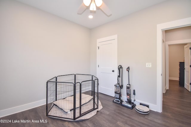 bedroom with ceiling fan and dark wood-type flooring