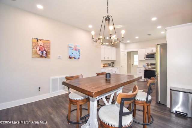 dining room with a chandelier and dark wood-type flooring