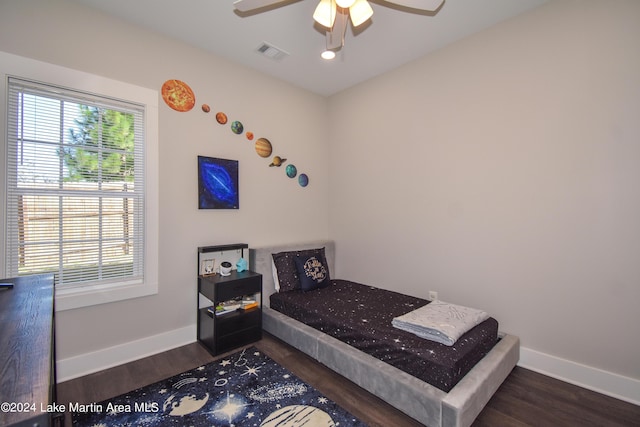 bedroom featuring dark hardwood / wood-style floors and ceiling fan