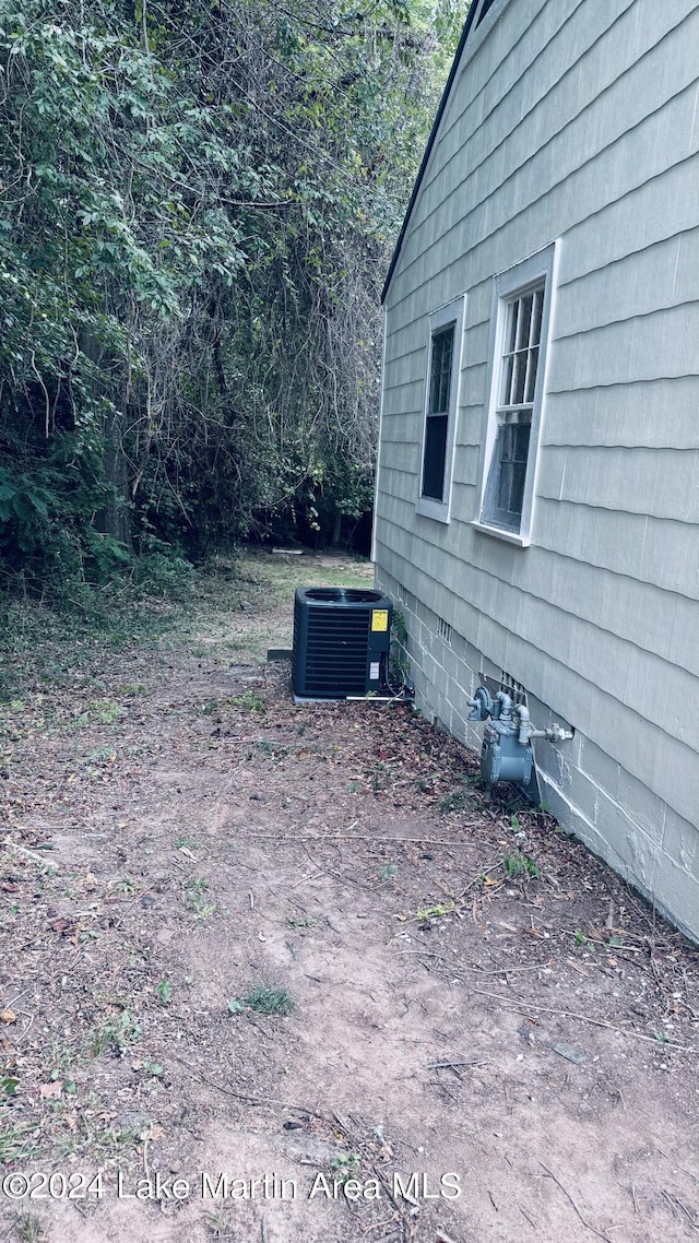 view of yard with central AC unit