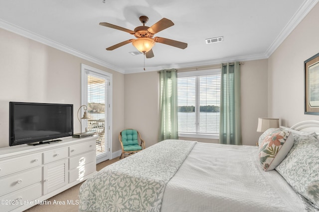 bedroom featuring access to outside, multiple windows, visible vents, and crown molding