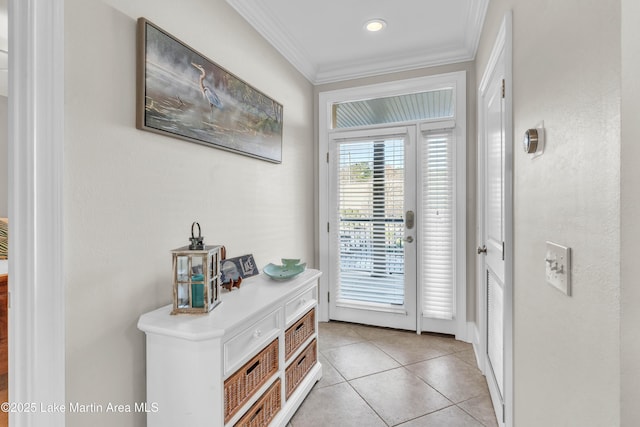 doorway to outside featuring light tile patterned floors and ornamental molding