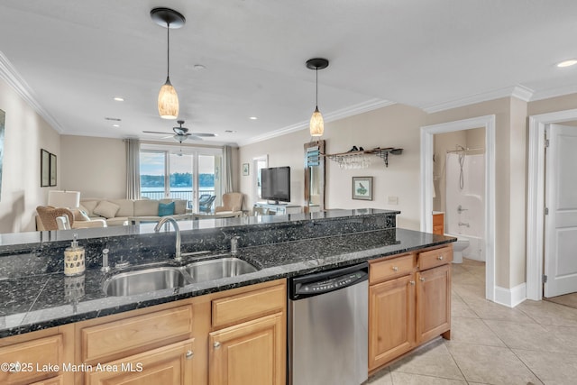 kitchen featuring light tile patterned floors, open floor plan, light brown cabinets, a sink, and dishwasher