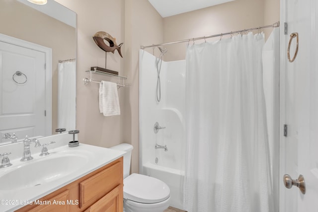 full bathroom with shower / bath combination with curtain, vanity, and toilet