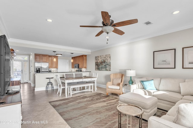 living area featuring visible vents, crown molding, and light tile patterned flooring