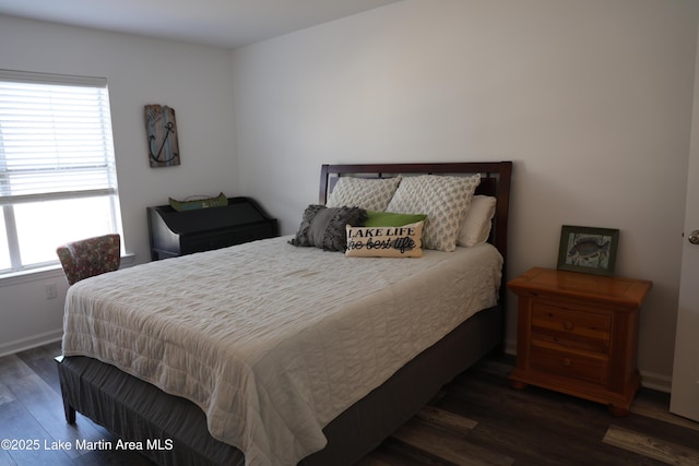 bedroom featuring dark wood-type flooring