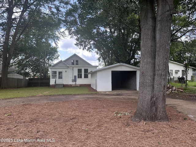 104 Central Blvd, East Tallassee, AL 36078 - view of front facade with an outdoor structure, a detached garage, and entry steps