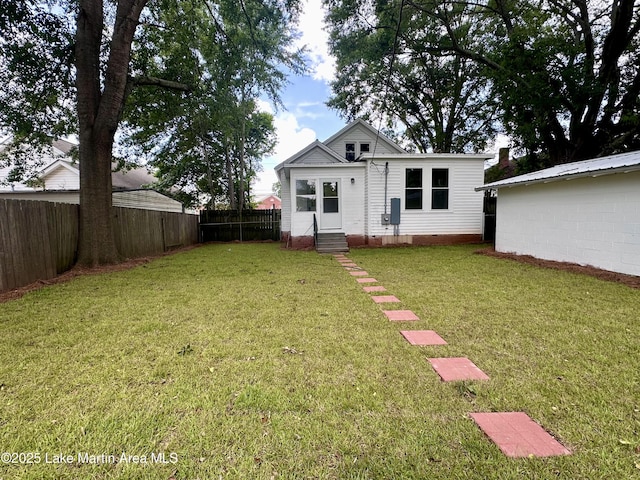 104 Central Blvd, East Tallassee, AL 36078 - rear view of property featuring a fenced backyard and crawl space