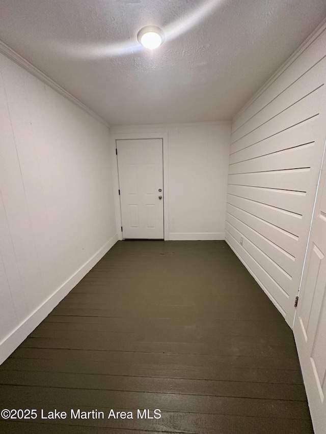 104 Central Blvd, East Tallassee, AL 36078 - unfurnished room featuring a textured ceiling and wooden walls