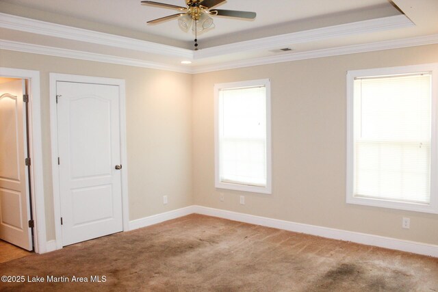 295 Landers Loop, Sylacauga, AL 35150 - empty room featuring a tray ceiling, light colored carpet, ceiling fan, and crown molding