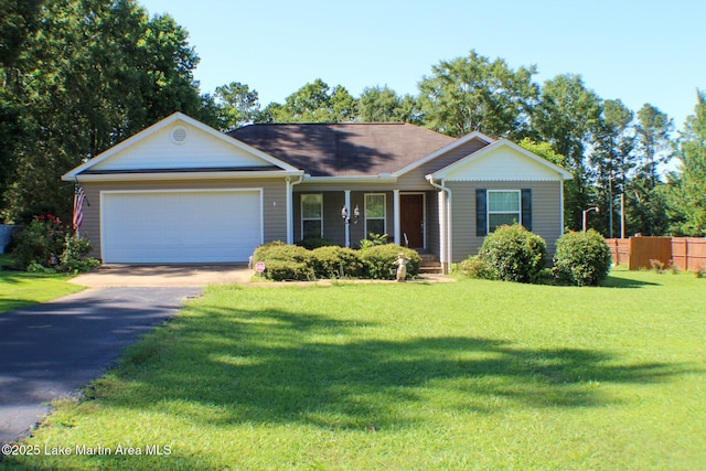 295 Landers Loop, Sylacauga, AL 35150 - single story home with a porch, driveway, an attached garage, and a shingled roof