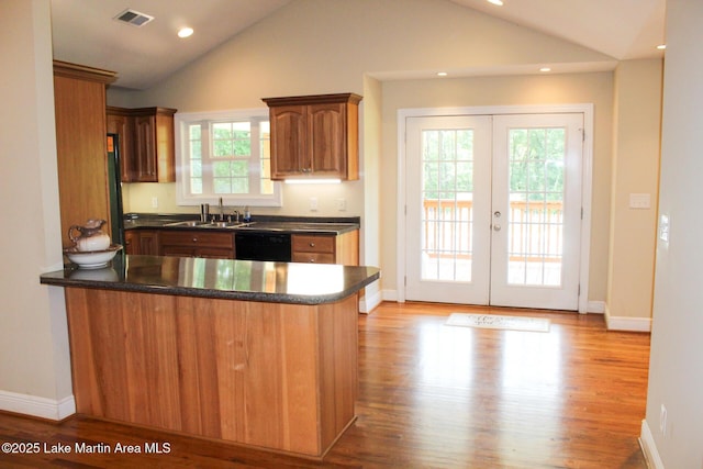 295 Landers Loop, Sylacauga, AL 35150 - kitchen with a peninsula, dark countertops, lofted ceiling, french doors, and black dishwasher