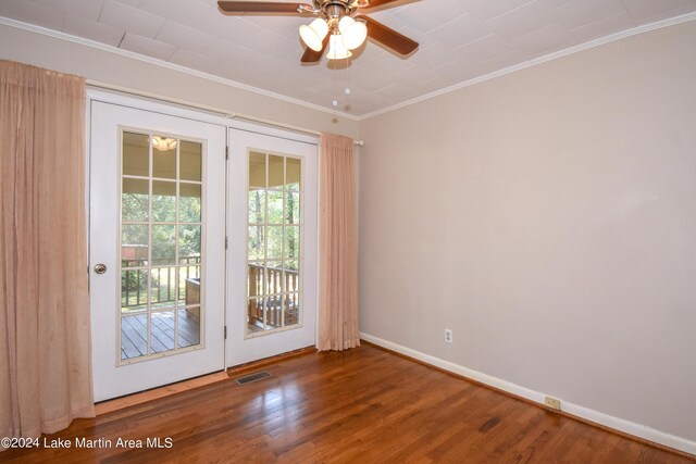 unfurnished room featuring hardwood / wood-style floors, ceiling fan, and crown molding