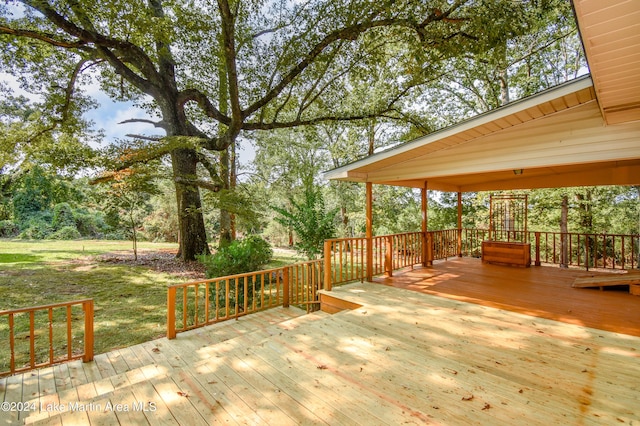 wooden deck with a lawn