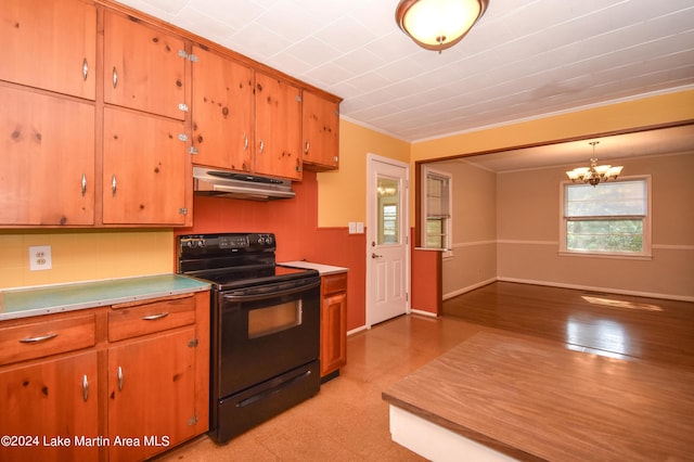 kitchen featuring pendant lighting, an inviting chandelier, black / electric stove, and crown molding