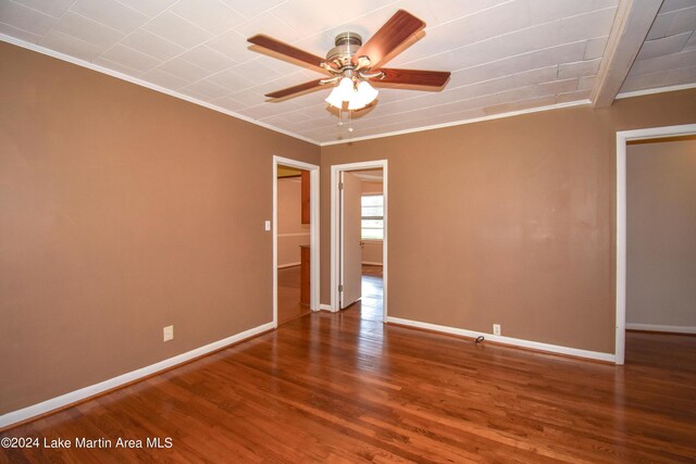 unfurnished room with hardwood / wood-style flooring, ceiling fan, and ornamental molding