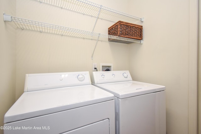 clothes washing area with washer and dryer