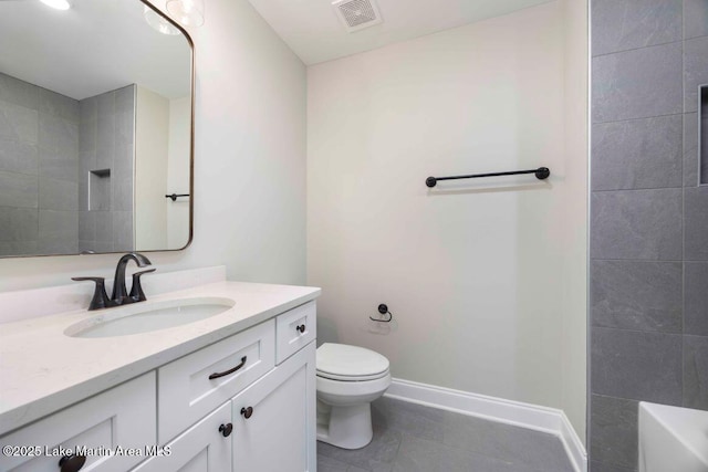 bathroom featuring vanity, tile patterned floors, a shower, and toilet