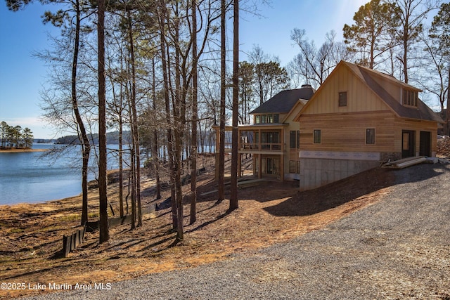 view of side of home featuring a water view