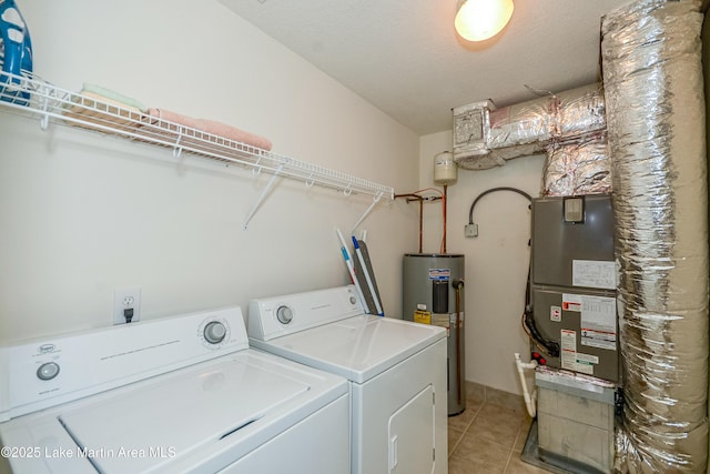 189 Williams Rd Unit # N2, Alexander City, AL 35010 - laundry area featuring water heater, washing machine and dryer, and light tile patterned flooring