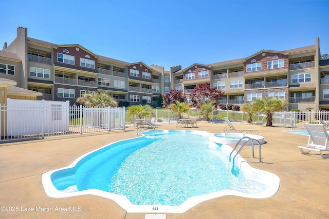 view of swimming pool featuring a patio area