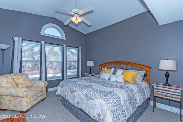 bedroom featuring ceiling fan, vaulted ceiling, and light carpet