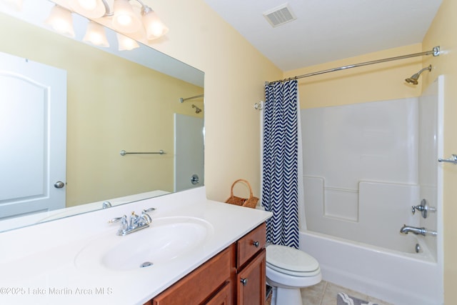 full bathroom with tile patterned flooring, vanity, shower / tub combo, and toilet